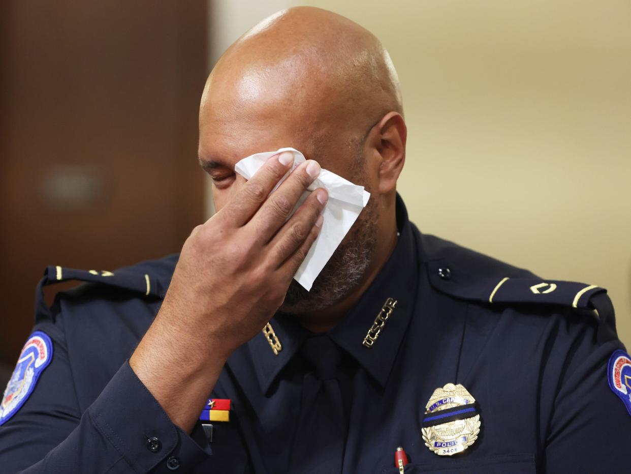 Private First Class Harry Dunn of the US Capitol Police wipes tears away as a video showing scenes of the January 6th attack is played before the House Select Committee investigating the January 6 attack on US Capitol on July 27, 2021 at the U.S. Capitol in Washington, DC.