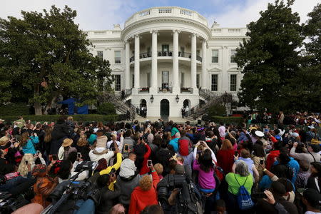 Guests attend the annual Easter Egg Roll at the White House in Washington March 28, 2016. REUTERS/Jonathan Ernst