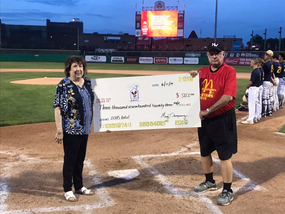 Mary Breznay and Dave Rodgers present a check to the Ronald McDonald House Charities for a total of $3,723 during the 2019 McDonald's all-star baseball games at Dozer Park.