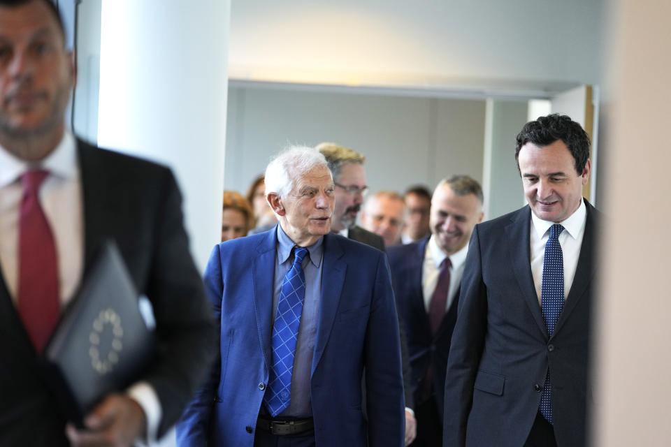 Kosovo's Prime Minister Albin Kurti, right, walks with European Union foreign policy chief Josep Borrell, center, prior to a meeting in Brussels, Thursday, Sept. 14, 2023. The leaders of Serbia and Kosovo are holding a fresh round of meetings on Thursday aimed at improving their strained relations as calls mount for a change in the Western diplomatic approach toward them amid concern that their tensions could spiral out of control. (AP Photo/Virginia Mayo)