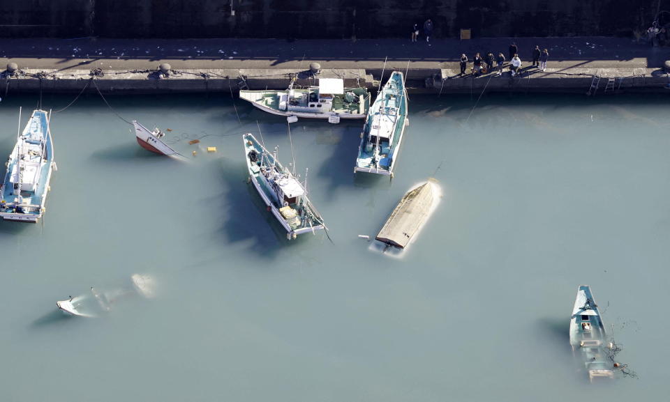 An aerial view shows capsized boats believed to be affected by the tsunami caused by an underwater volcano eruption on the island of Tonga at the South Pacific, in Muroto, Kochi prefecture, Japan, in this photo taken by Kyodo January 16, 2022.  Mandatory credit Kyodo/via REUTERS ATTENTION EDITORS - THIS IMAGE WAS PROVIDED BY A THIRD PARTY. MANDATORY CREDIT. JAPAN OUT. NO COMMERCIAL OR EDITORIAL SALES IN JAPAN.
