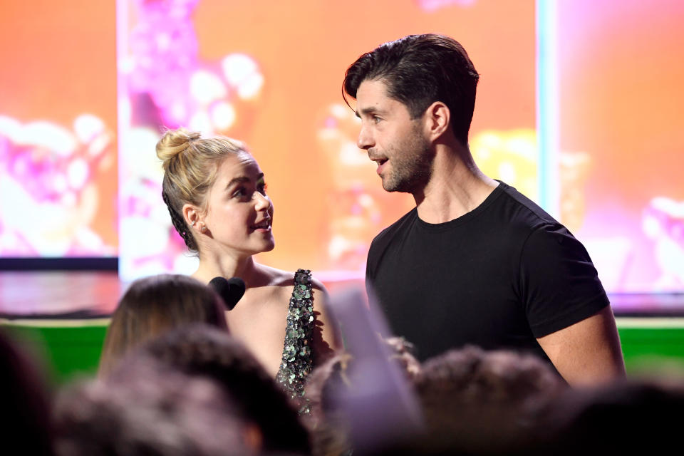 Josh Peck and Kiernan Shipka engaging in conversation onstage