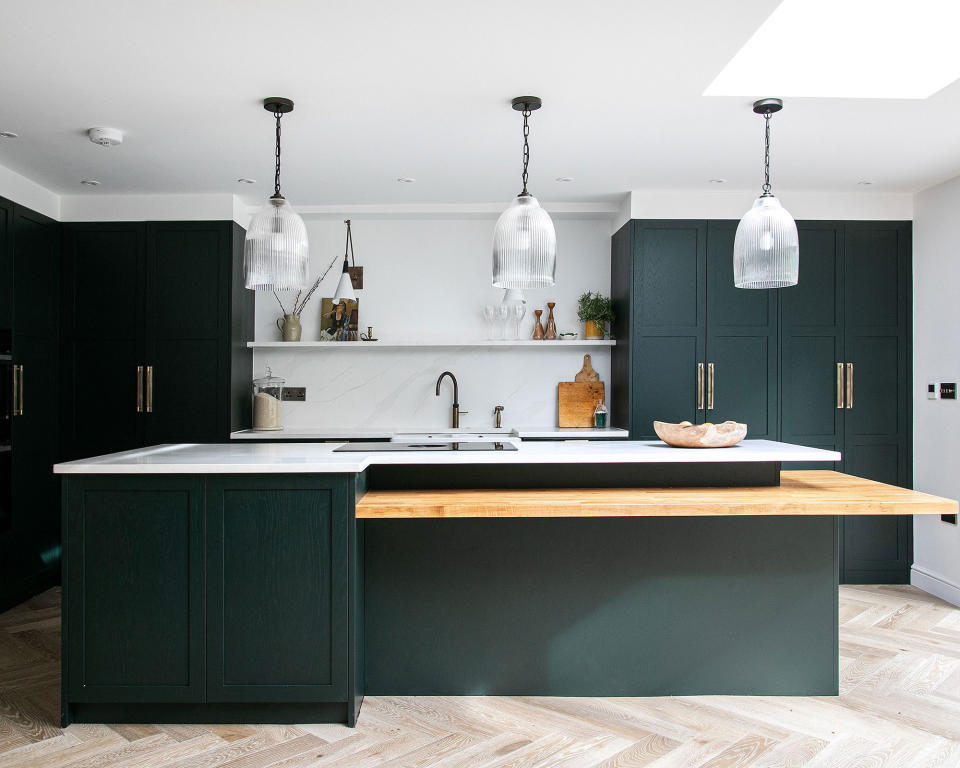 two-tier kitchen island with dark green painted design