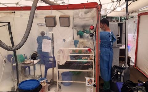 The Ebola "cube" which enables families to see their loved ones - Credit: Djaffar Al Katanty/Reuters