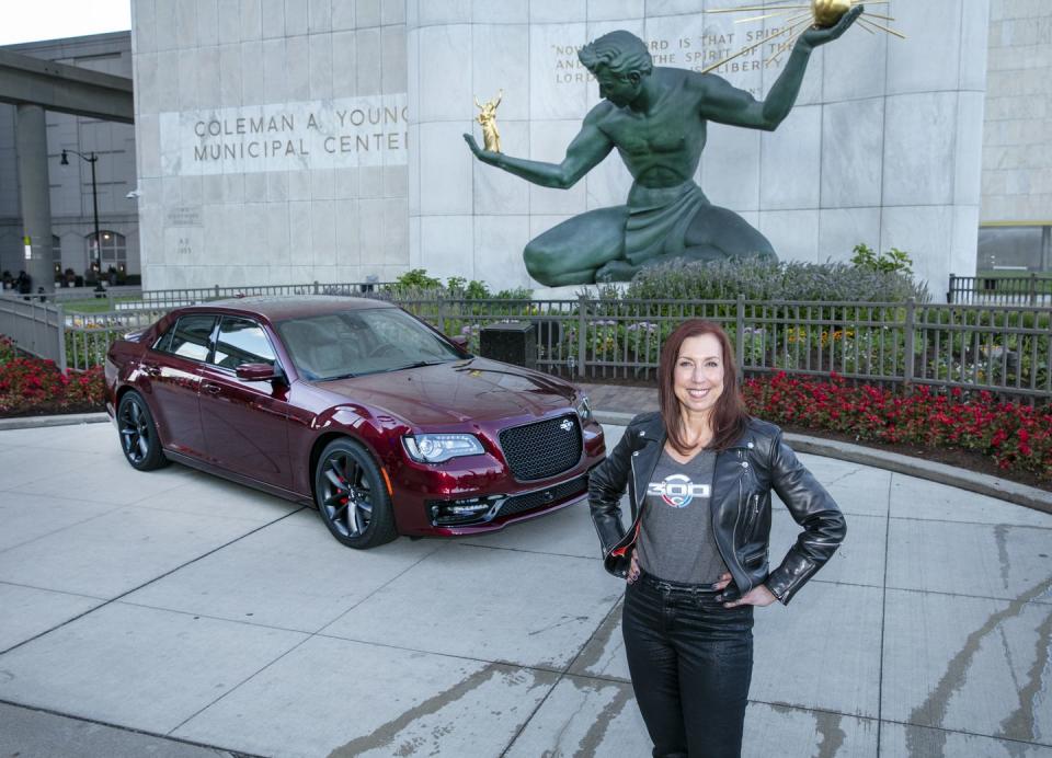 christine feuell with the departing 2023 chrysler 300c at the 2022 detroit auto show