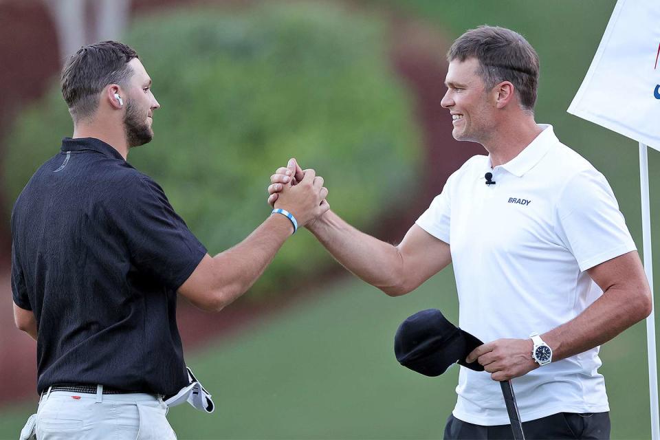 Josh Allen and Tom Brady embrace during Capital One's The Match VI - Brady & Rodgers v Allen & Mahomes at Wynn Golf Club on June 01, 2022 in Las Vegas, Nevada.