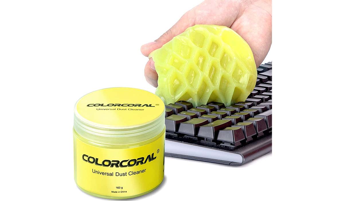 Yellow putty removing dust on a keyboard.