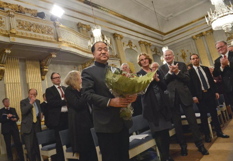 The 2012 Nobel Literature Prize laureate, Mo Yan of China receives applause from Academy members after speaking during the traditional Nobel lecture Friday Dec. 7, 2012 at the Royal Swedish Academy in Stockholm, Sweden. (AP Photo/Jonas Ekstromer)