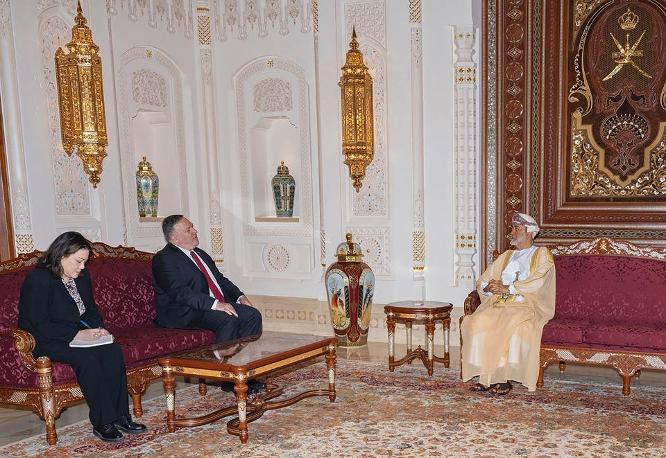 In this photo released by the state-run Oman News Agency, U.S. Secretary of State Mike Pompeo, center, meets with Oman's Sultan Haitham bin Tariq in Muscat, Oman, Thursday, Aug. 27, 2020. Pompeo visited Oman's new sultan on Thursday, the last stop on a Mideast trip that sought to build on an American-brokered deal to have Israel and the United Arab Emirates normalize relations. (Oman News Agency via AP)