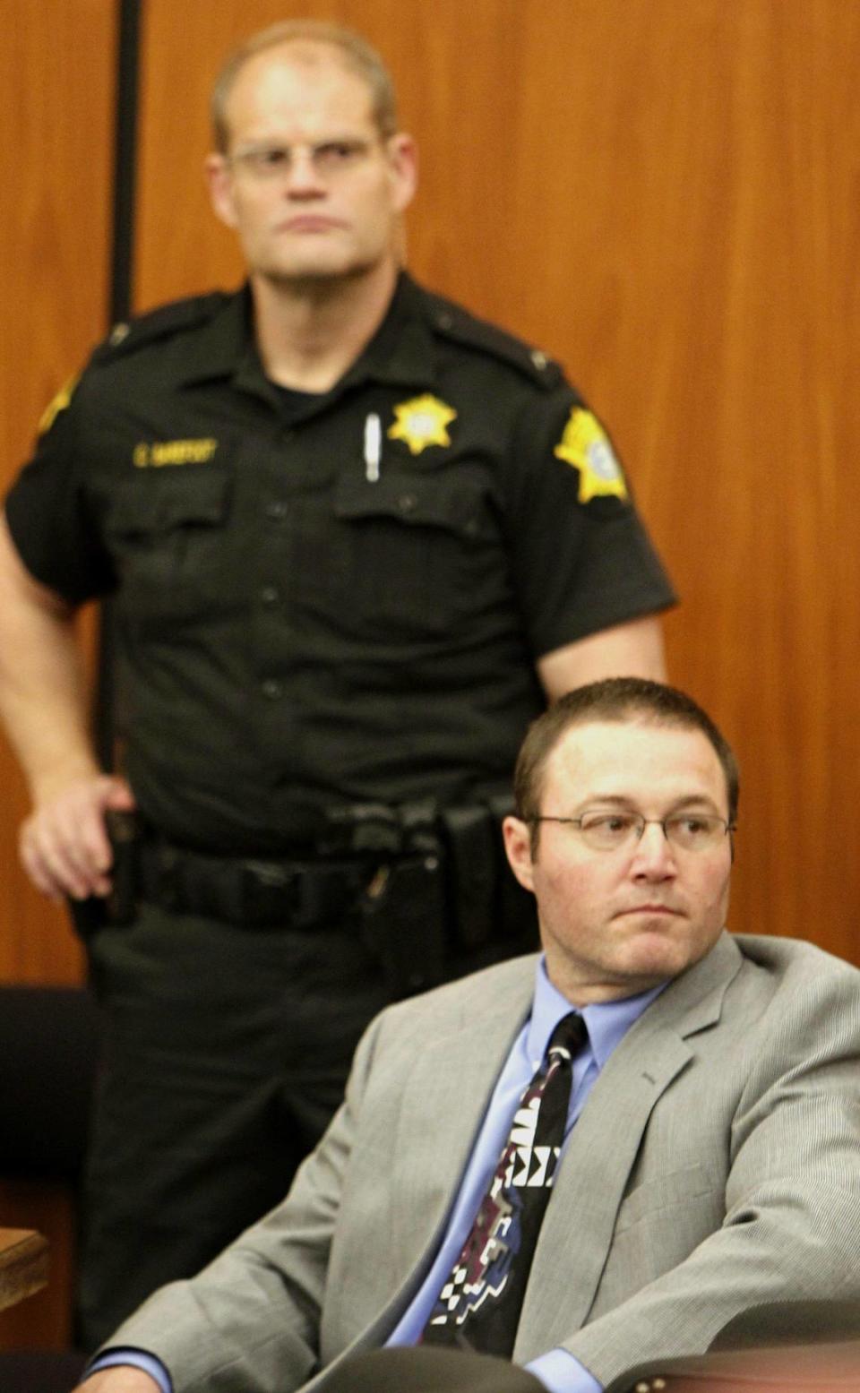 Brett Parker awaits the start of his 2013 murder trial in Richland County. He was convicted of killing his wife and friend.