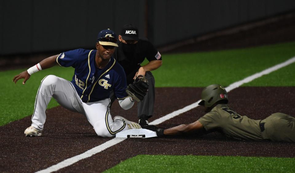 Jun 6, 2021; Nashville, TN, USA; Vanderbilt Commodores outfielder Enrique Bradfield Jr. (51) steals third base ahead of the tag by Georgia Tech Yellow Jackets utility Justyn-Henry Malloy (42) during the fourth inning in the Nashville Regional of the NCAA Baseball Tournament at Hawkins Field. Mandatory Credit: Christopher Hanewinckel-USA TODAY Sports