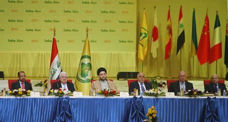 Iraq's Speaker of Parliament Salim al-Jabouri (L) President Fouad Massoum (2nd L), Prime Minister Haider al-Abadi (2nd R) and Ammar al-Hakim (C), leader of the Islamic Supreme Council of Iraq (ISCI), attend a conference dialogue among religious sects in Baghdad January 31, 2015. REUTERS/Khalid al-Mousily