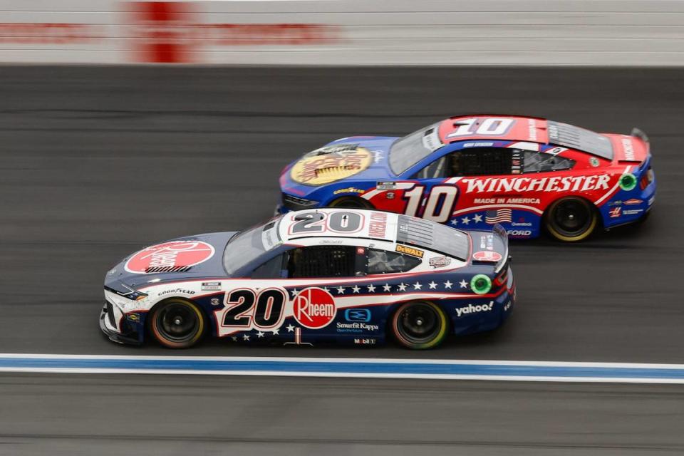 Christopher Bell (20) drives alongside Noah Gragson (10) in the first half during the Coca-Cola 600 at Charlotte Motor Speedway in Concord on Sunday, May 26, 2024.