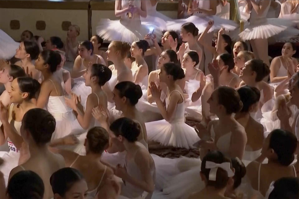 This image taken from video shows dozens of young dancers waiting to hear if they have broken a world record for dancing on pointe in one place in the Plaza Hotel, Wednesday, April 17, 2024, in New York. The spectacle was organized by Youth America Grand Prix, a ballet scholarship program that is celebrating its 25th anniversary with three nights of performances at the Lincoln Center for the Performing Arts. (AP Photo)