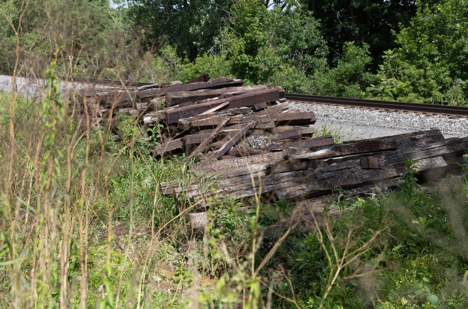 A pile of railroad ties rests on the tracks behind the home of Lawrence Township resident Chase Horvath. The ties are left over from last year's Norfolk Southern derailment along Manchester Avenue NW.