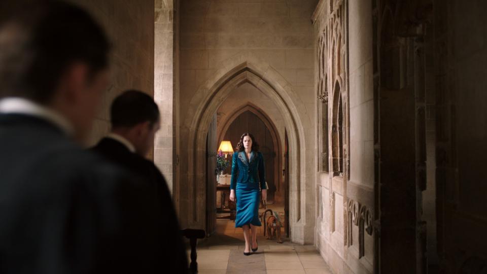 Ruth Wilson's Mrs. Coulter walks down a hall at Jordan College
