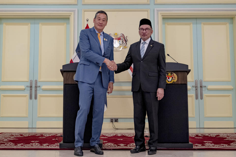 Thai Prime Minister, Srettha Thavisin, left, shakes hands with Malaysia's Prime Minister Anwar Ibrahim on the occasion of Thavisin's official visit to Malaysia, in Jakarta, Wednesday, Oct. 11, 2023. (Afiq Hambali/Prime Minister’s Office of Malaysia via AP)