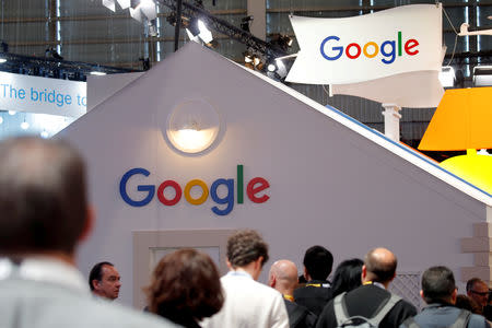 Visitors pass by the logo of Google at the high profile startups and high tech leaders gathering, Viva Tech,in Paris, France May 16, 2019. REUTERS/Charles Platiau/Files