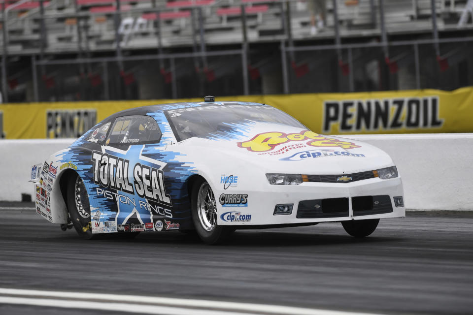 In this photo provided by the NHRA, Pro Stock driver Matt Hartford coasts to his second victory at the Mopar Express Lane NHRA SpringNationals at Houston Raceway Park in Baytown, Texas, when he defeated Deric Kramer in the final round Monday, May 24, 2021. (Gary Nastase/Auto Imagery via AP)