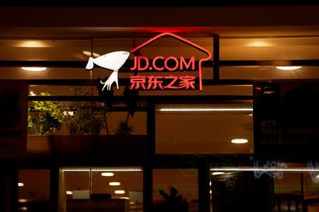 FILE PHOTO: A sign of China's e-commerce company JD.com is seen at its shop at a mall in Shanghai, China October 26, 2018. REUTERS/Aly Song