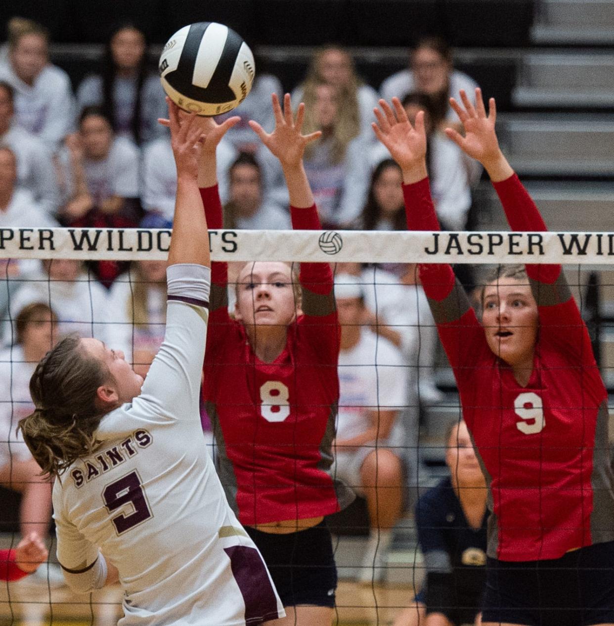 Tecumseh’s Ava Kissel (8) and Jenna Donohoo (9) block against Indianapolis Lutheran’s Hadleigh Filipovich (9) during the Class A semi state volleyball game at Jasper High School in Jasper, Ind., Saturday afternoon, Oct. 29, 2022. 