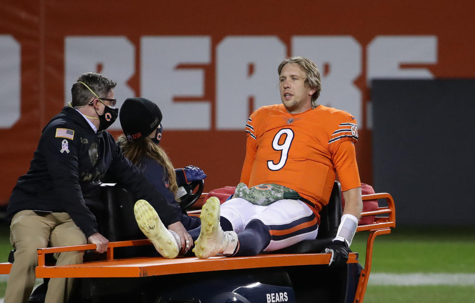 CHICAGO, ILLINOIS - NOVEMBER 16:   Nick Foles #9 of the Chicago Bears is carted off of the field after being hit by Ifeadi Odenigbo #95 of the Minnesota Vikings during the fourth quarter of the game at Soldier Field on November 16, 2020 in Chicago, Illinois.  (Photo by Jonathan Daniel/Getty Images)