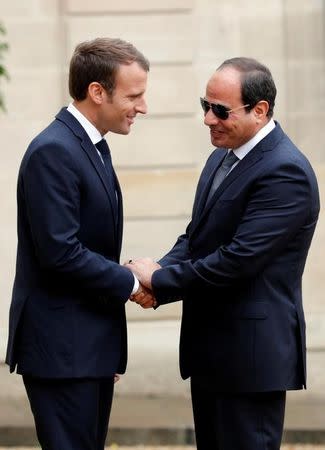 French President Emmanuel Macron welcomes Egyptian President Abdel Fattah al-Sisi at the Elysee Palace, in Paris, France, October 24, 2017. REUTERS/Philippe Wojazer