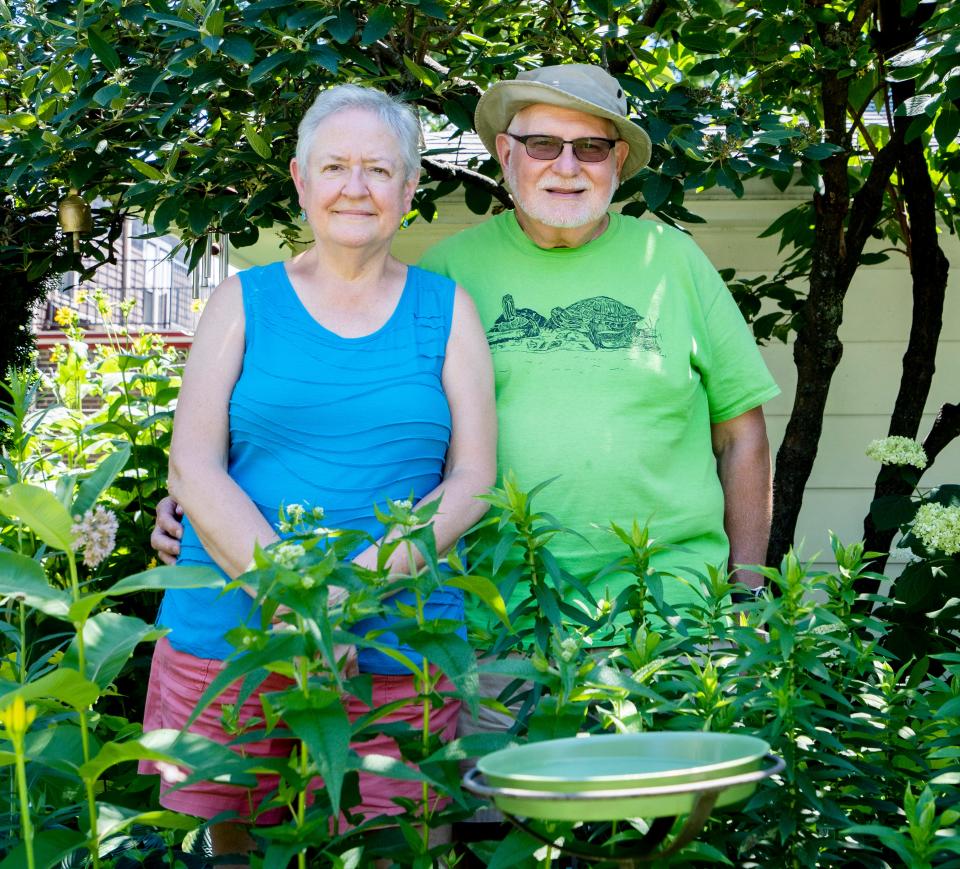 Doreen and Tom Hickey both love their Milwaukee  garden, but he likes to "play in the mud" while she cares for monarch butterflies and cuts grass.