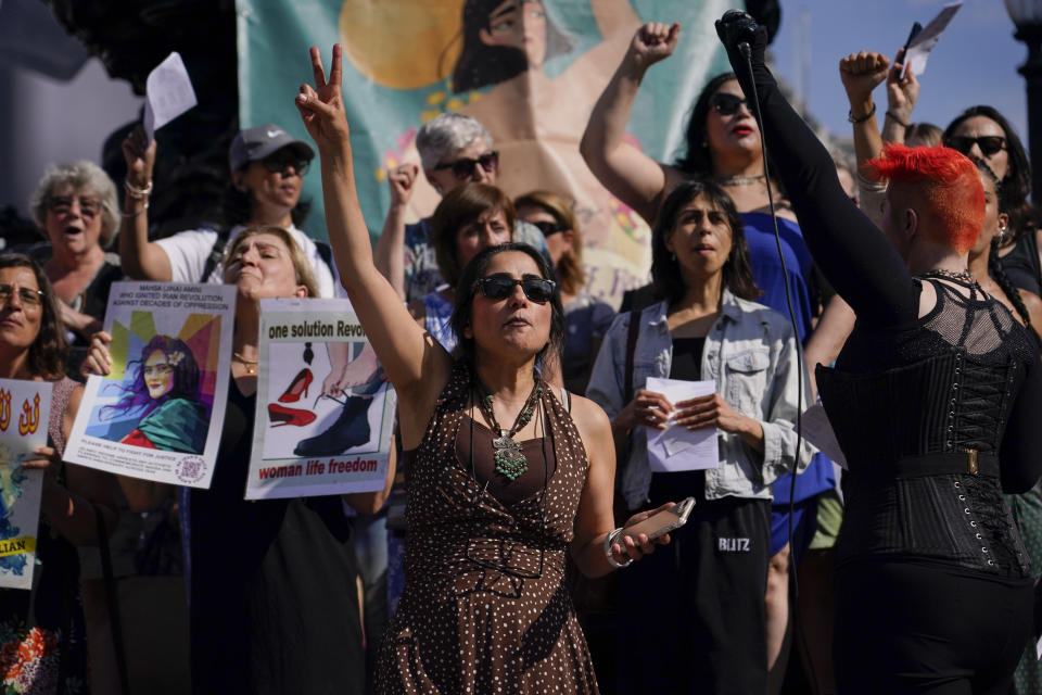 Human rights activist Maryam Namazie speaks at a protest in Piccadilly Circus,in London, Saturday, Sept. 16, 2023, as today marks the anniversary of the death of Mahsa Amini in Iran. (AP Photo/Alberto Pezzali)