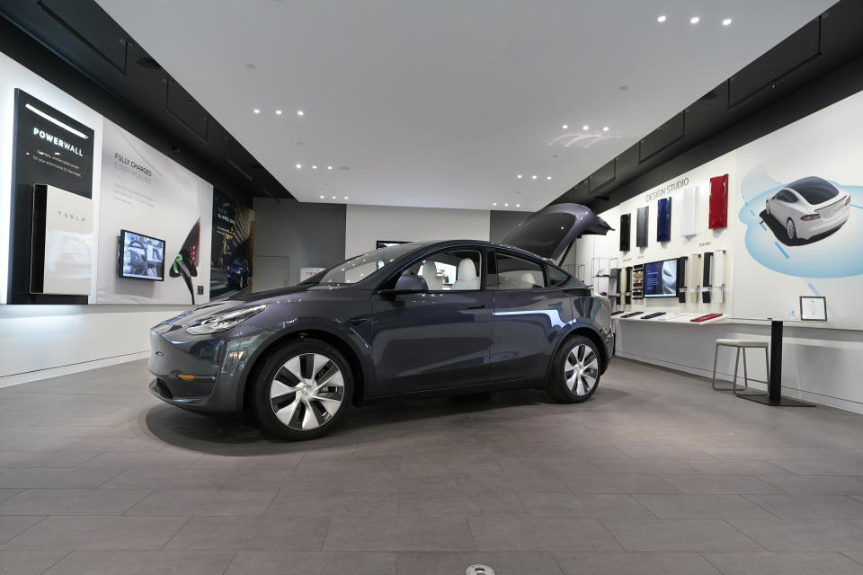 FILE - A Tesla Model Y Long Range is displayed on Feb. 24, 2021, at the Tesla Gallery in Troy, Mich. Consumer Reports says electric SUVs generally are among the least reliable vehicles on the road, but it’s not because of the batteries or electric motors that power them. Compact and plug-in gas-electric hybrids were the most reliable category. (AP Photo/Carlos Osorio, File)