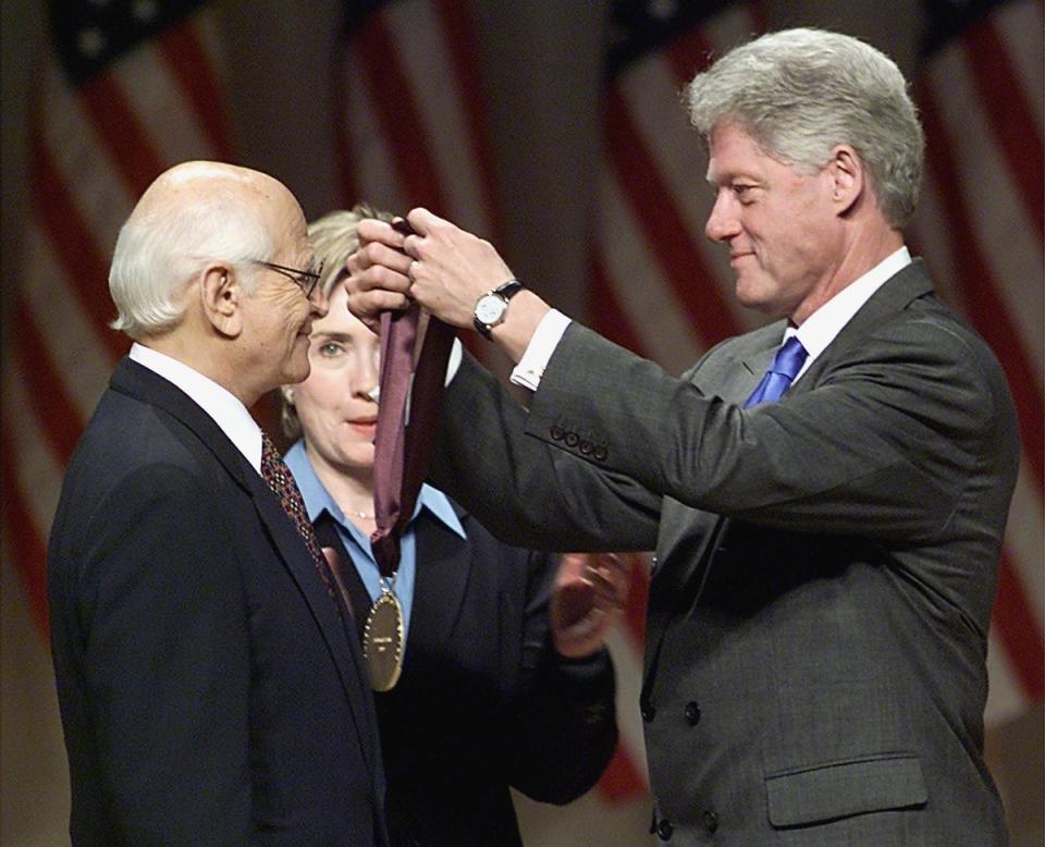 Receiving the National Medal of Arts and Humanities Award from president Bill Clinton in 1999 (AFP via Getty Images)