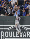 Detroit Tigers center fielder Derek Hill (54) goes up the wall in an attempt to grab a three-run home run hit by Kansas City Royals' Ryan O'Hearn during the fourth inning of a baseball game at Kauffman Stadium in Kansas City, Mo., Friday, July 23, 2021. (AP Photo/Colin E. Braley)