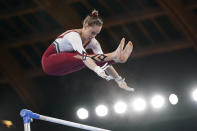 Sarah Voss, of Germany, performs on the uneven bars during the women's artistic gymnastic qualifications at the 2020 Summer Olympics, Sunday, July 25, 2021, in Tokyo. (AP Photo/Ashley Landis)