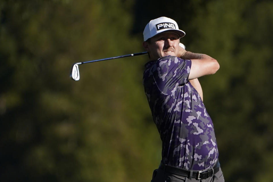 Mackenzie Hughes, of Canada, watches his shot from the 18th fairway during the second day of the Sanderson Farms Championship golf tournament in Jackson, Miss., Friday, Sept. 30, 2022. (AP Photo/Rogelio V. Solis)