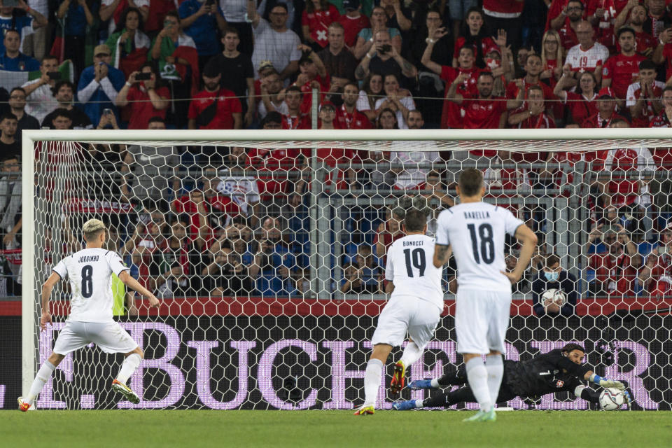 FILE - Switzerland goalkeeper Yann Sommer, right, catches the penalty kick of Italy's Jorginho, left, during the World Cup 2022 Group C qualifying soccer match between Switzerland and Italy at the St. Jakob-Park stadium in Basel, Switzerland, on Sunday, Sept. 5, 2021. (Jean-Christophe Bott/Keystone via AP, File)