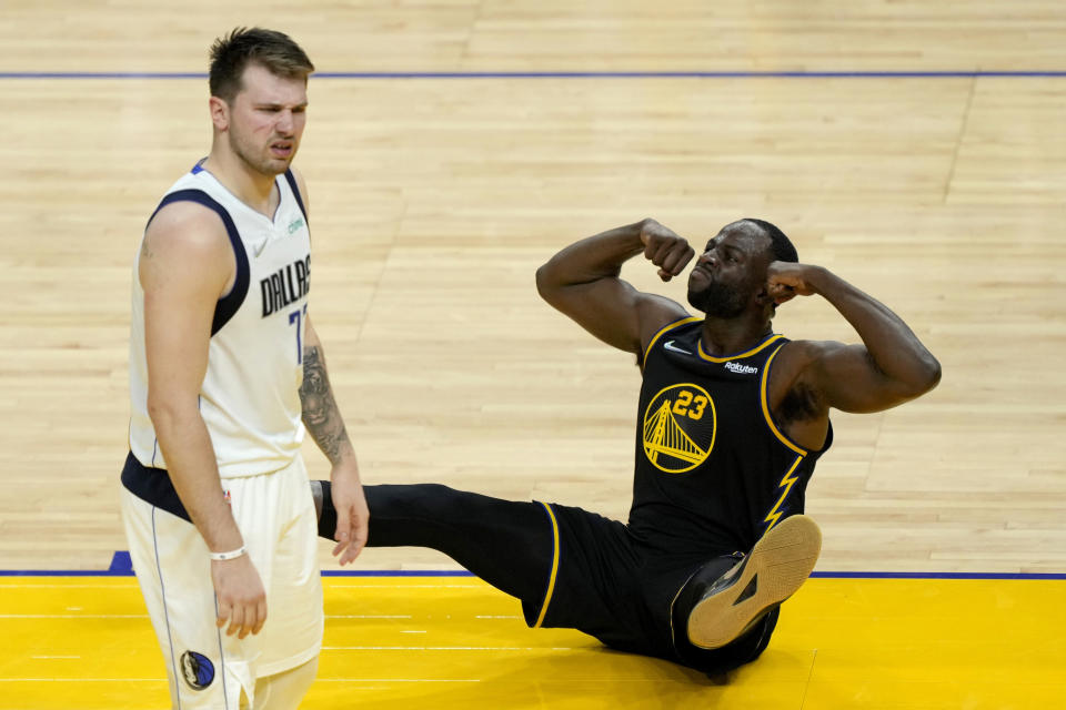 Golden State Warriors forward Draymond Green reacts against Dallas Mavericks guard Luka Doncic in Game 1 of the Western Conference finals at Chase Center in San Francisco on May 18, 2022. (Thearon W. Henderson/Getty Images)