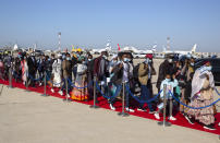 Ethiopian immigrants arrive at the Ben Gurion airport near Tel Aviv, Israel, Thursday, Dec. 3, 2020. Hundreds of Ethiopian immigrants on Thursday arrived to a festive ceremony at Israel's international airport, as the government took a step toward carrying out its pledge to reunite hundreds of families split between the two countries. (AP Photo/Sebastian Scheiner)