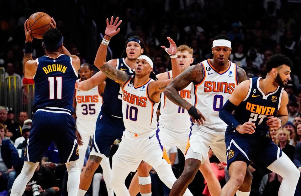 Phoenix Suns guard Damion Lee (10) covers Denver Nuggets forward Bruce Brown (11) in the first half during Game 2 of the Western Conference Semifinals at Ball Arena in Denver on May 1, 2023.