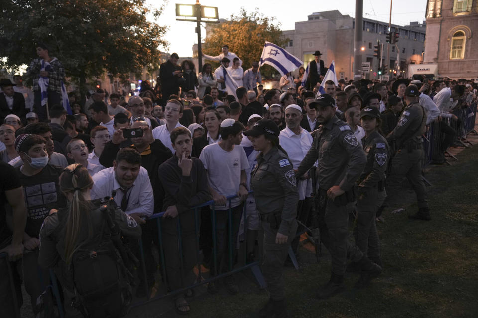 Israeli security forces block right wing activists from marching towards Jerusalem's Old City, Wednesday, April 20, 2022. Police prevented hundreds of ultra-nationalist Israelis from marching around predominantly Palestinian areas of Jerusalem's Old City. The event planned for Wednesday was similar to one that served as one of the triggers of last year's Israel-Gaza war. (AP Photo/Maya Alleruzzo)