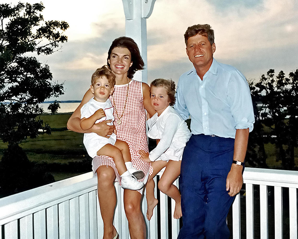 John and Jackie Kennedy with their children John and Caroline at their family home in Hyannis Port in 1962 - Credit: Ken Hawkins / Alamy Stock Photo
