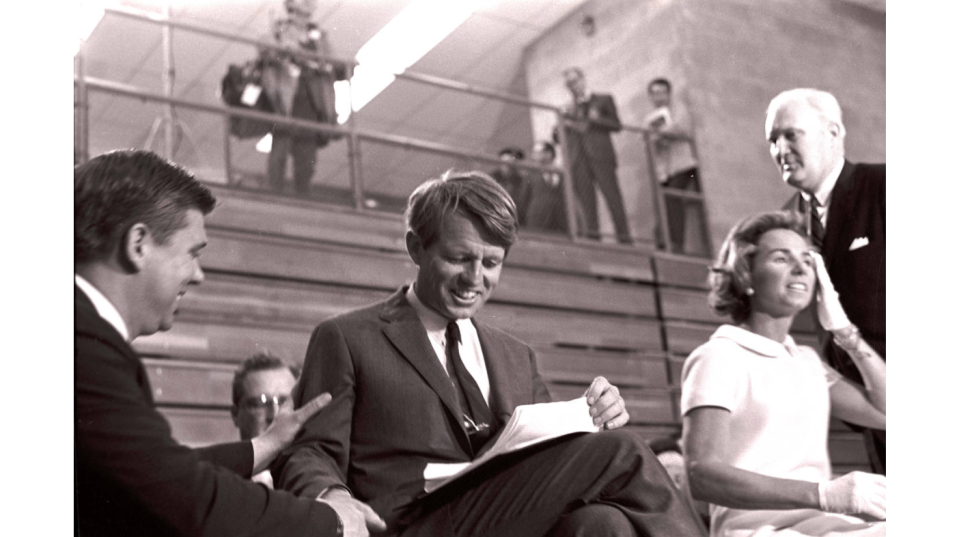 Robert F. Kennedy and his wife, Ethel Kennedy, prepare for an appearance at Irving Gym, (then called the Men's Gym) on the campus of Ball State University, April 4, 1968. Hours later Kennedy would learn of the slaying of Martin Luther King Jr. and deliver a more famous speech from the back of a truck in an inner city neighborhood in Indianapolis.