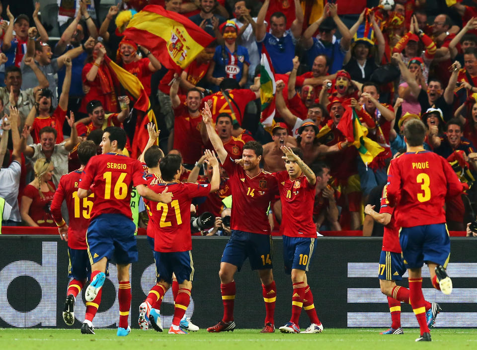 Xabi Alonso of Spain celebrates after scoring the first goal with team mates during the UEFA EURO 2012 quarter final match between Spain and France at Donbass Arena on June 23, 2012 in Donetsk, Ukraine. (Photo by Martin Rose/Getty Images)