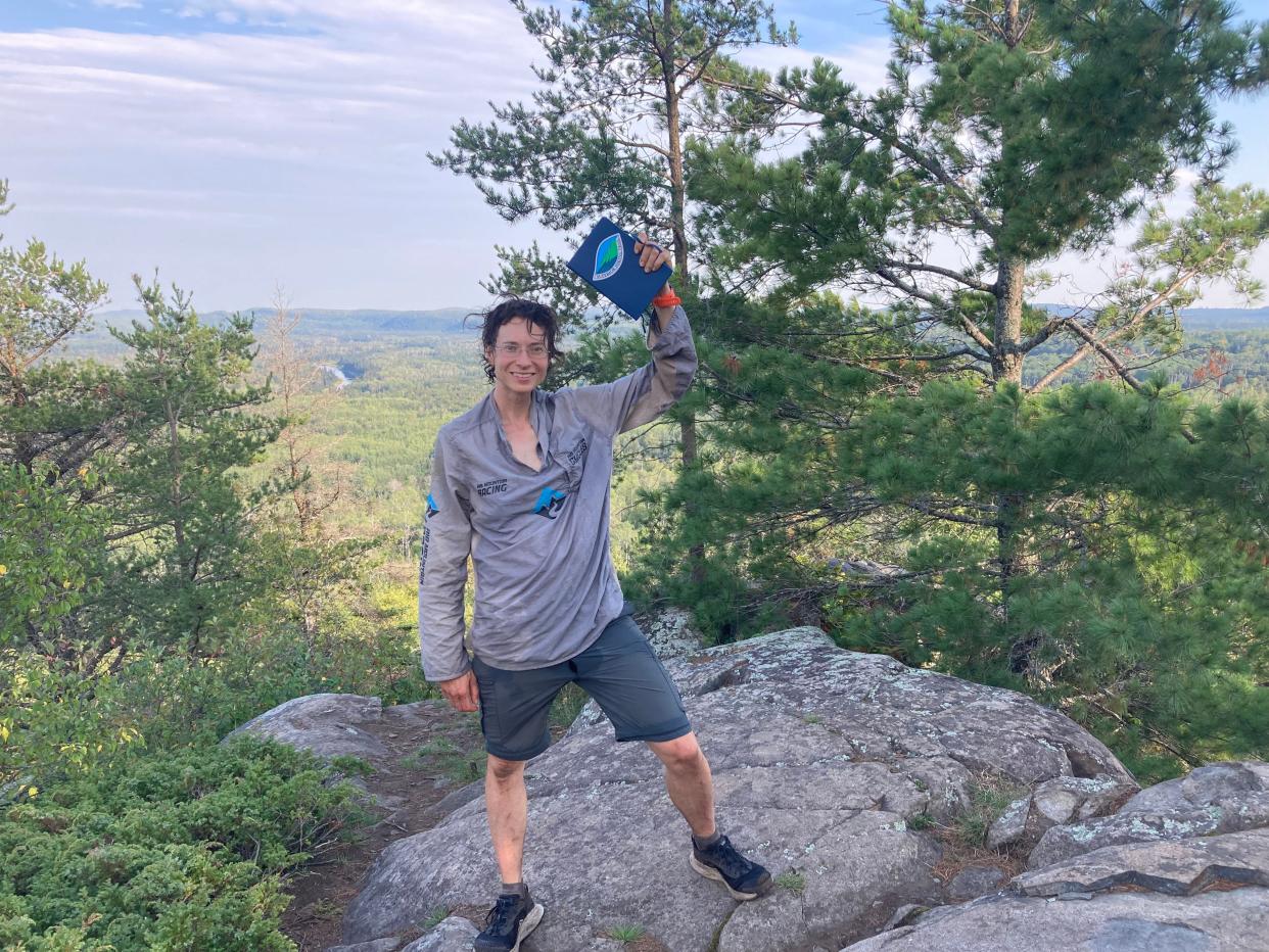 Andrea Larson takes time for a victorious selfie near the end of her record-setting run on the Superior Hiking Trail in northern Minnesota.