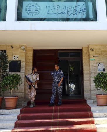 Libyan soldiers stand guard outside the Supreme Court during a hearing to discuss the legitimacy of the election of the country's Prime Minister Ahmed Maiteeq in Tripoli June 9, 2014. REUTERS/Stringer