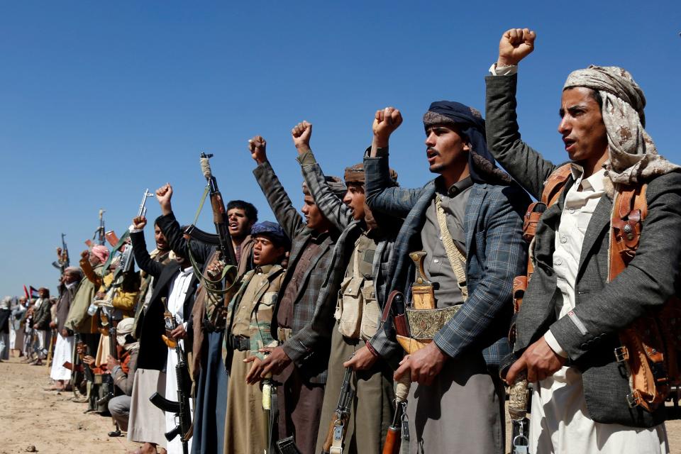 Houthi fighters and tribesmen stage a rally against the U.S. and the U.K. strikes on Houthi-run military sites near Sanaa, Yemen, on Jan. 14, 2024