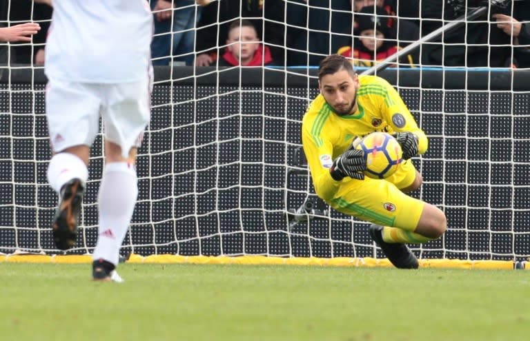 AC Milan's goalkeeper Gianluigi Donnarumma makes a save during their Italian Serie A match against Benevento Calcio, at the Ciro Vigorito Stadium in Benevento, on December 3, 2017