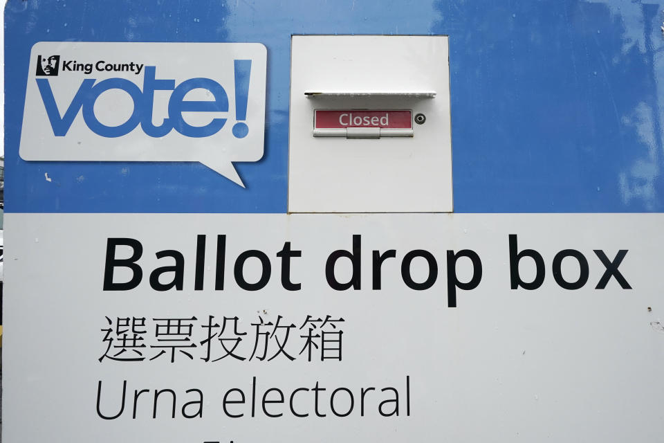 A King County ballot drop box, closed until ballots are mailed about three weeks before the election, stands on a Seattle street Thursday, Sept. 24, 2020. (AP Photo/Elaine Thompson)