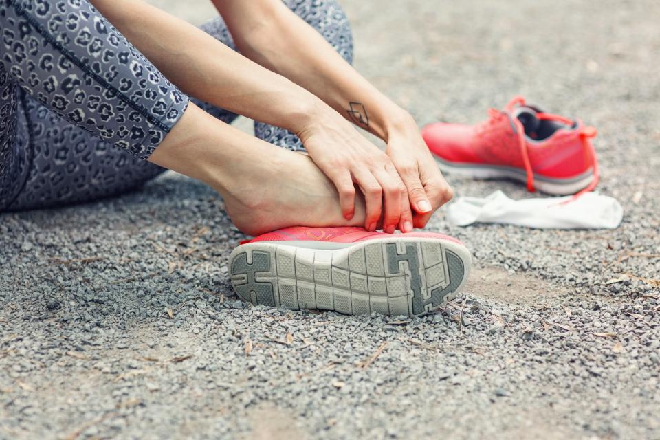 Image of female hands massaging her injured footGetty Images/iStockphoto