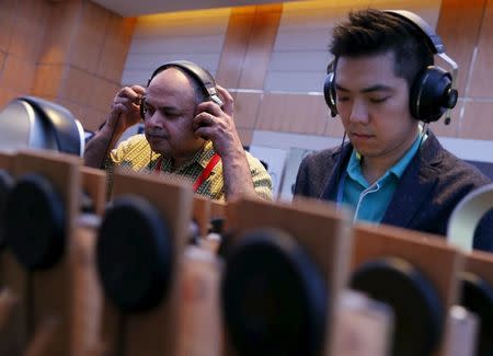 People test headphones during the CanJam headphone and personal audio expo in Singapore February 21, 2016. REUTERS/Edgar Su