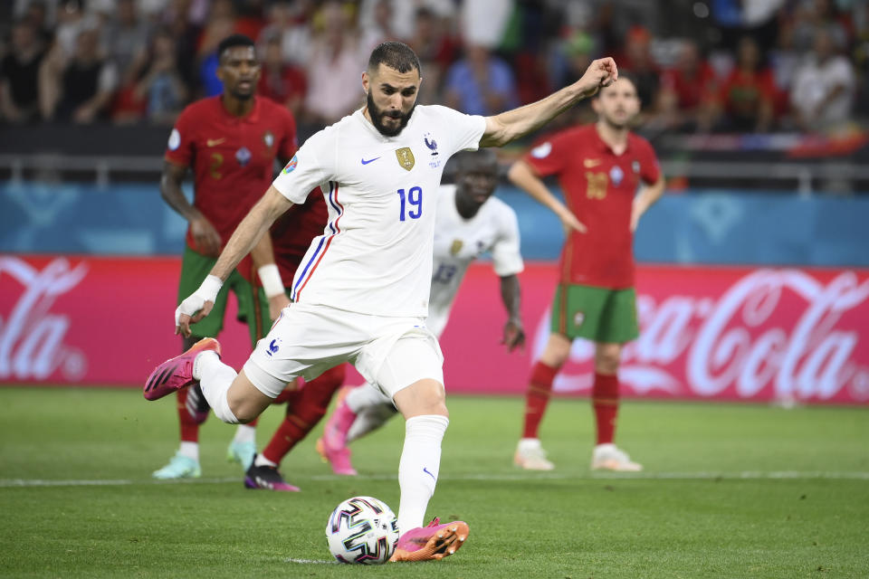 France's Karim Benzema scores his side's first Goa; from the penalty spot during the Euro 2020 soccer championship group F match between Portugal and France at the Puskas Arena in Budapest, Wednesday, June 23, 2021. (Franck Fife, Pool photo via AP)